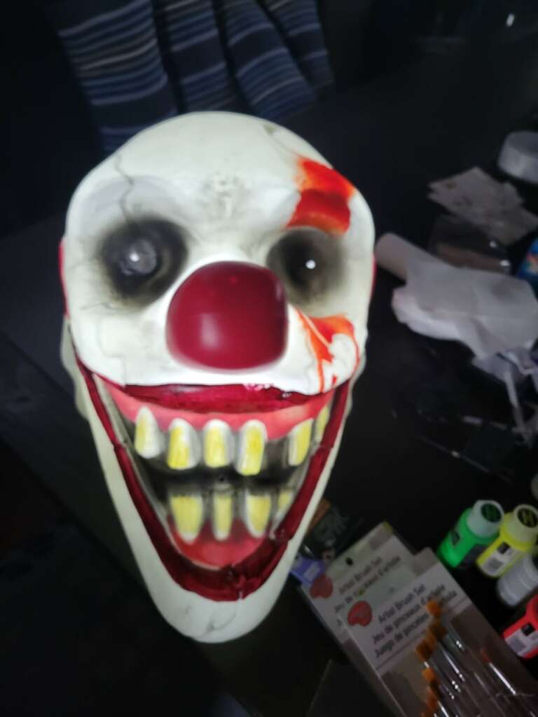 Haunted house scenes with skeletons, clowns and ghouls