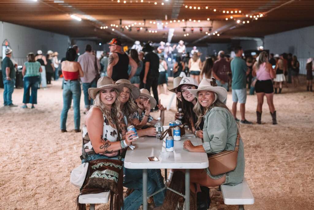Guests under string lights